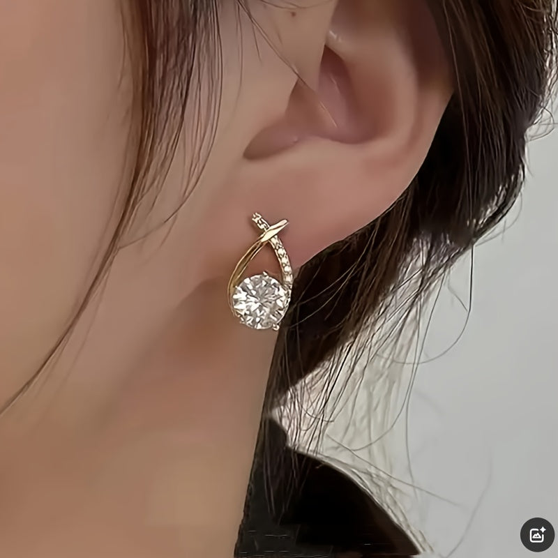 Aretes de botón con cruz dorada de circonia