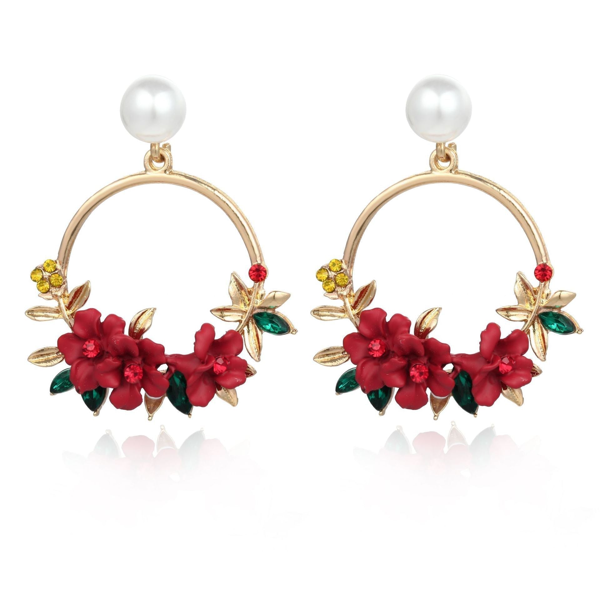 Aretes elegantes de flor en oro con perlas