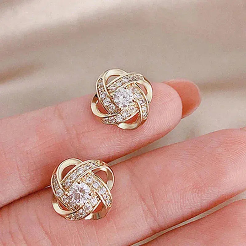 Aretes de botón florales en espiral dorados con cristal